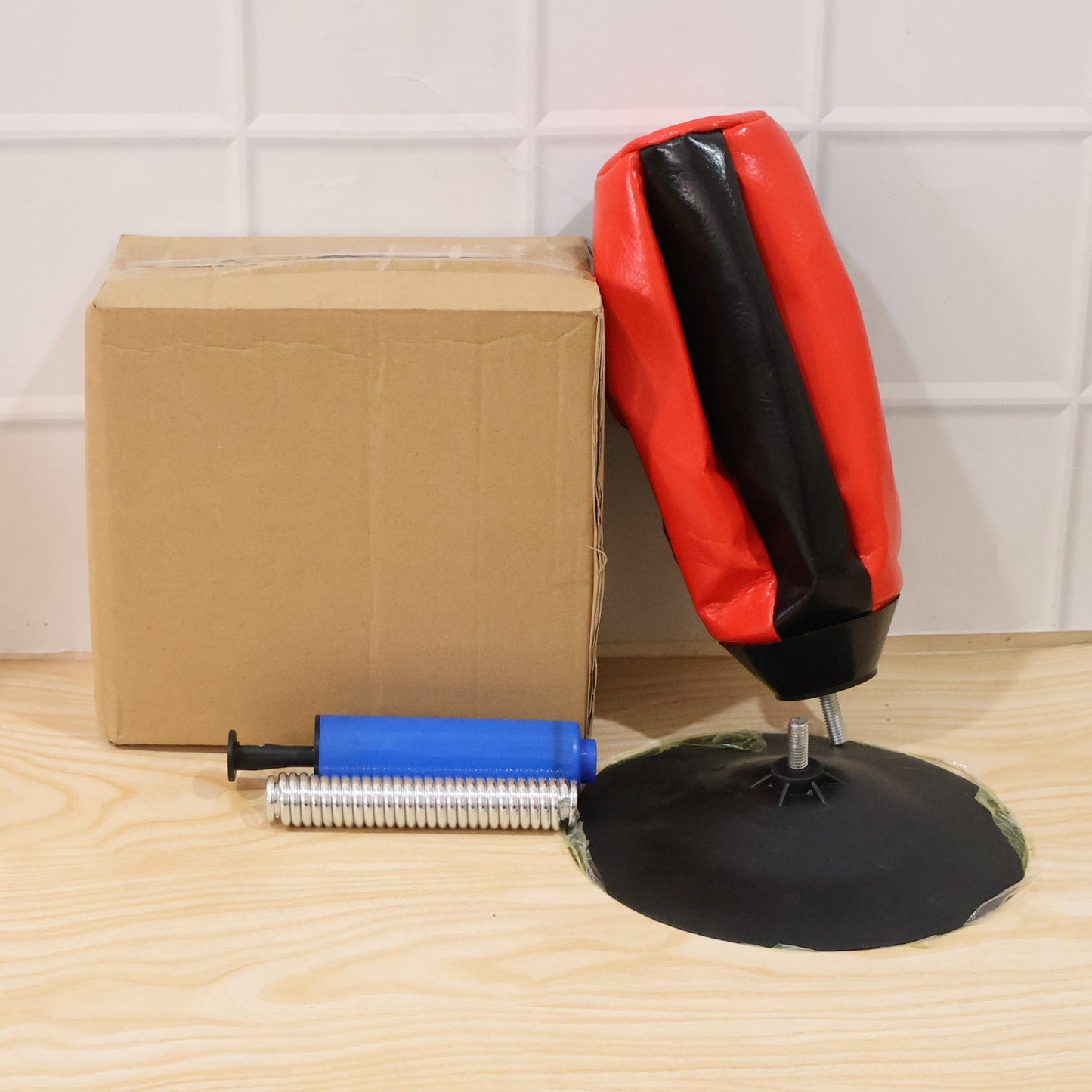 Inflatable punching bag for stress relief and reflex training