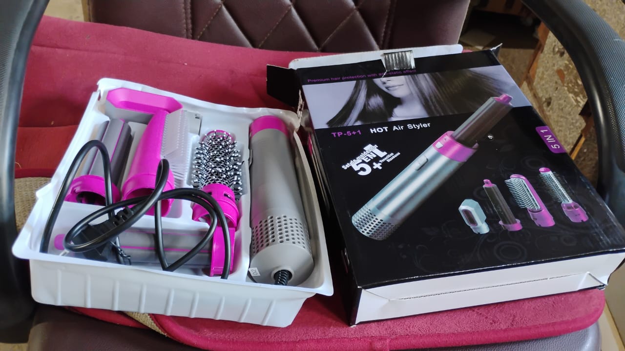 Side angled view of 5 In 1 Hair Dryer Brush showing ergonomic design