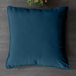 Soft decorative pillow covers in a living room setting.