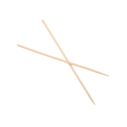 Close-up view of bamboo BBQ skewers holding food on a grill.