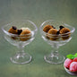 Elegant glass dessert bowl on a footed base, perfect for serving.