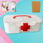 White portable medicine storage box with a transparent lid and red cross symbol, shown from the front.