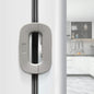 White fridge freezer door lock latch installed on refrigerator door for baby safety