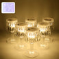 Set of six battery operated LED mini table lamps with crystal-effect shades creating a decorative glow.