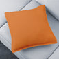 A stylish brown decorative pillow cover on a sofa, adding warmth to the living room.