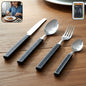 24-piece stainless steel cutlery set with plastic handles and tray laid out