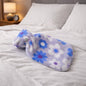 Floral printed hot water bag with soft plush cover showing floral design