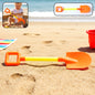 Kids beach sand shovel with wide scoop lying on sandy surface