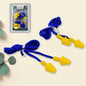 Soft silicone ear plugs in Christmas tree shape for comfortable hearing protection.