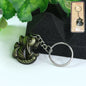 Front view of Ganesh Face Antique Black Metal Keychain showing detailed Ganesh design