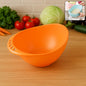 Top view of a versatile plastic rice washing bowl, ready for use.