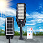 Solar LED street light with high-powered LED array, motion sensor, and remote control for outdoor use