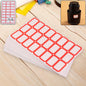 Writable label stickers with red border on bottles and containers