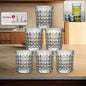 A set of six diamond-cut glass tumblers arranged neatly, showcasing their elegant design.