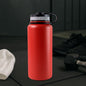 Red stainless steel vacuum insulated water bottle with double wall design