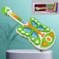 Child happily playing with the colourful butterfly musical guitar toy.