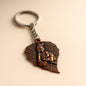 Bal Krishna keychain with antique bronze finish and peepal leaf design