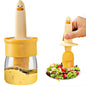 A clear plastic oil dispenser bottle with an integrated blue silicone basting brush.