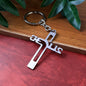 Metal cross keychain featuring Gujarati Jesus script on polished metal