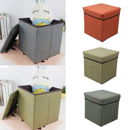 A compact cube storage stool in a living room setting, demonstrating its functionality as extra seating and storage.