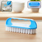 Handheld cleaning scrub brush with ergonomic handle and strong bristles for heavy-duty use.