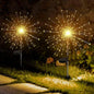 Decorative solar firework LED garden lights illuminating outdoor space