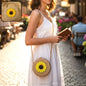 Mini round crossbody purse with sunflower design front view