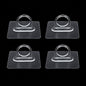 Adhesive plastic wall hook 4-piece set mounted on wall for home organisation