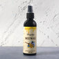 Beeswax Furniture Polish spray bottle highlighting natural ingredients for wood and leather care.