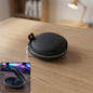Compact hard shell earphone carrying case for travel and protection