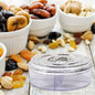Smiling round dry fruit box with four clear compartments.