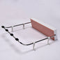 White foldable wash basin rack mounted on a wall, ready for use.