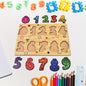 Toddler happily playing with a colorful wooden number puzzle board.