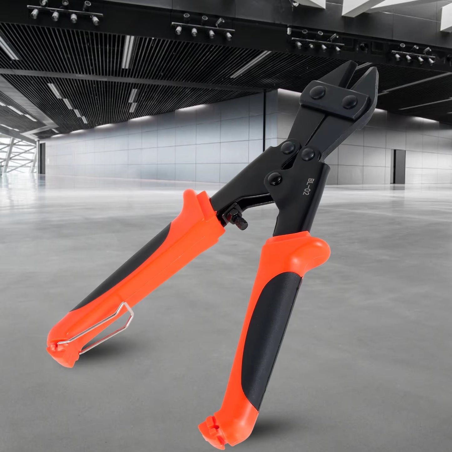 A hand demonstrating the mini bolt cutter effortlessly cutting a thick wire.