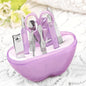 Compact apple-shaped manicure set with 8 stainless steel tools.