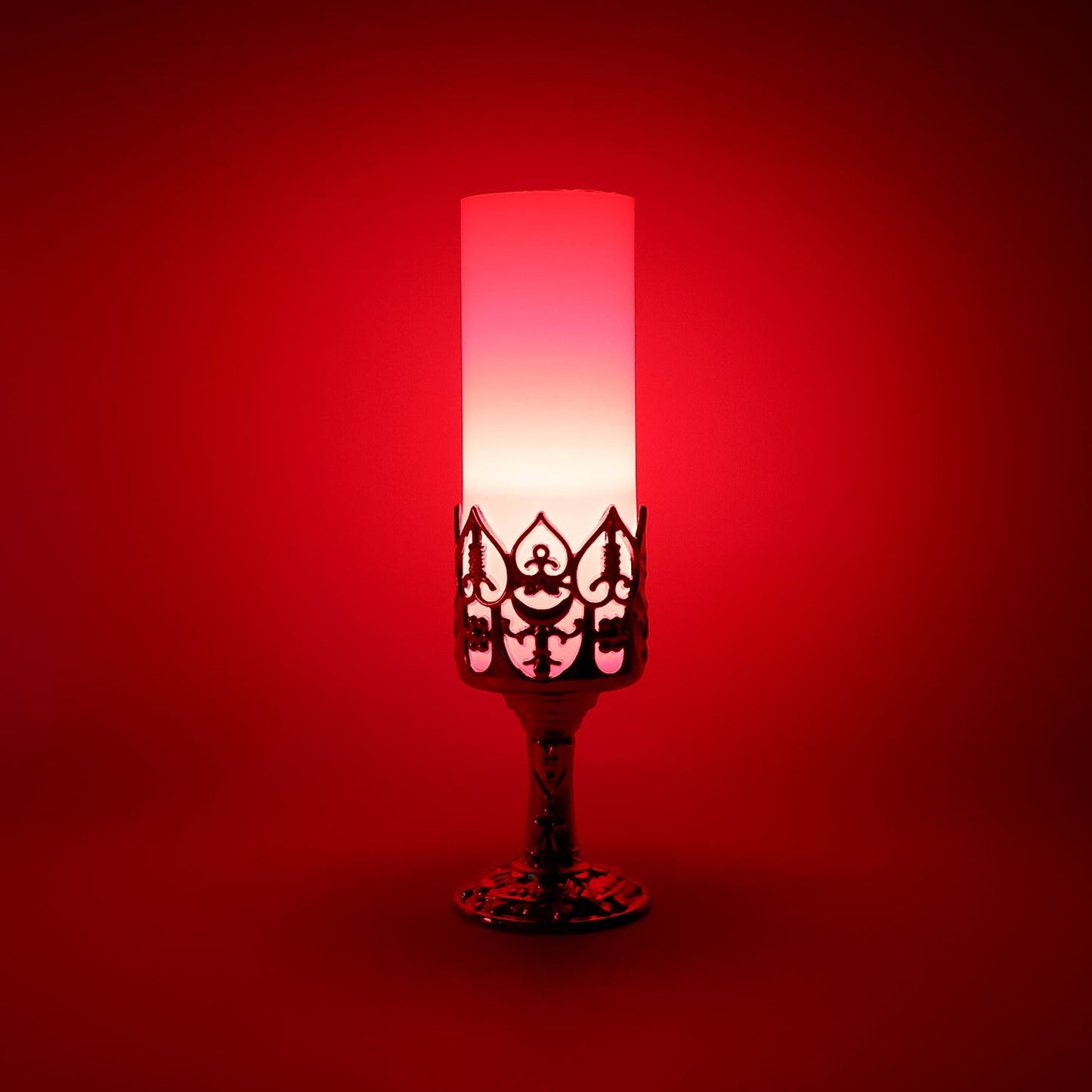 Close-up of LED candle lamp with elegant golden stand and cylindrical candle light