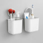 Wall mounted bathroom organizer cups set displayed in a modern bathroom