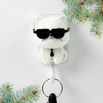 Detailed view of the cute cat face and interactive sunglasses feature on the wall hook.