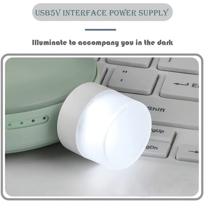 Close-up of a compact USB bulb emitting bright white light for room illumination.