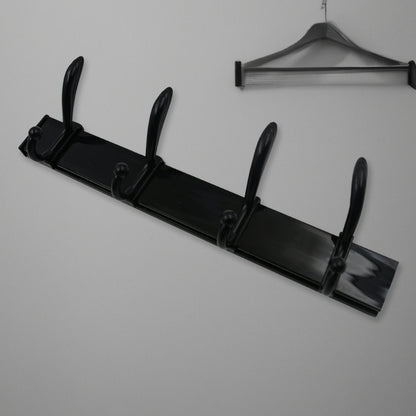Top-down view of the 4-hook wall mount coat hanger holding various coats and hats.