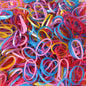 Multicolor elastic rubber bands neatly organized for office and home use.