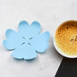 A vibrant set of six heat resistant coasters displayed on a wooden table, ready to protect surfaces.