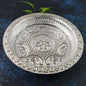 Silver finish plastic pooja thali with embossed floral design on surface