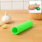 Silicone garlic peeler tube showing flexible rolling design
