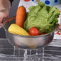 Stainless steel colander with ergonomic handle, viewed from above, showcasing fine mesh.
