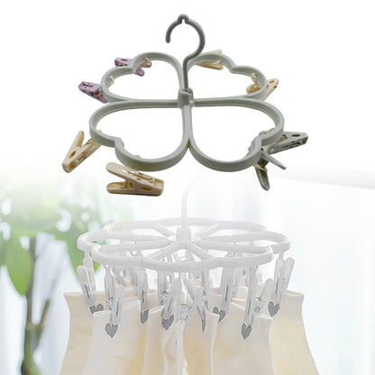 Pink heart-shaped drying rack showing strong, non-slip clips.