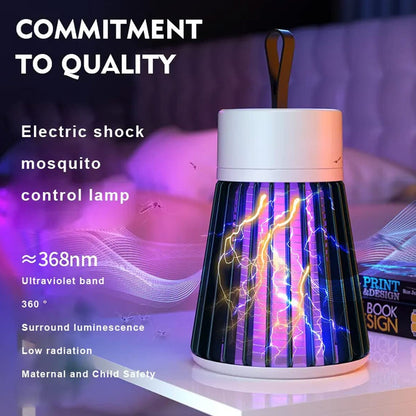 The Mosquito Killer Lamp emits purple light with lightning effects, sitting on a table next to a book.