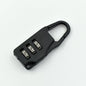 A sleek black 3-digit luggage lock securely attached to a suitcase zipper.
