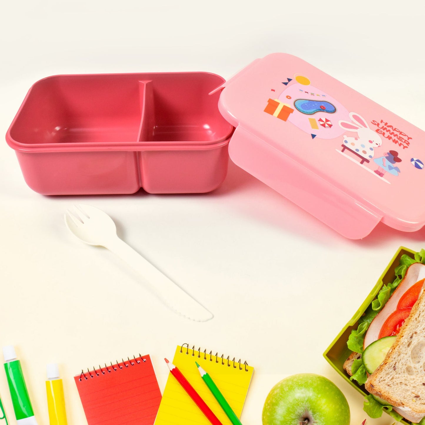 A blue leak-proof lunch box set displayed with its bottle and fork, highlighting its compact design.