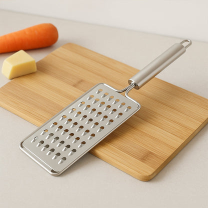 Flat stainless steel grater showing sharp blades and sturdy handle
